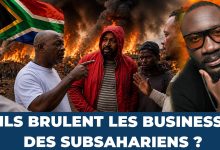 Commerçant africain devant une épicerie en Afrique du Sud