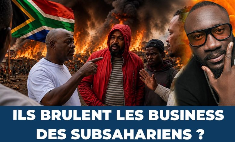 Commerçant africain devant une épicerie en Afrique du Sud